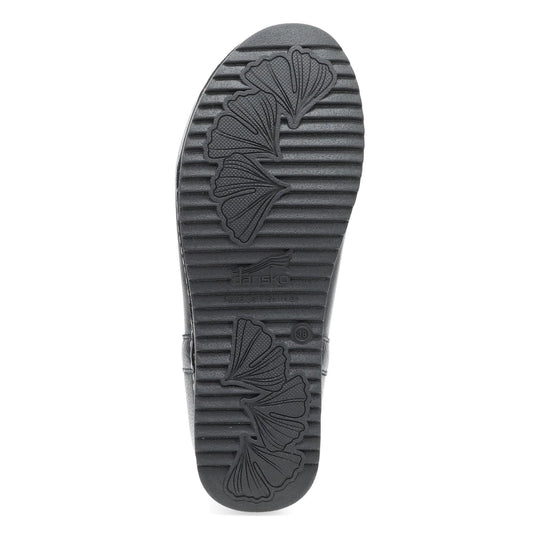 Black boot sole with leaf pattern tread and embossed Dansko logo