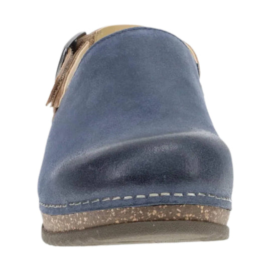 Blue suede mule shoe with a rounded back, contrast stitching, and a tan speckled sole