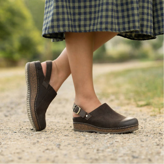 Brown suede closed-toe clog sandals with buckle strap and cork-look wedge soles