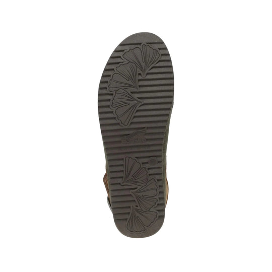 Sole of a dark brown shoe with leaf tread pattern and Dansko logo