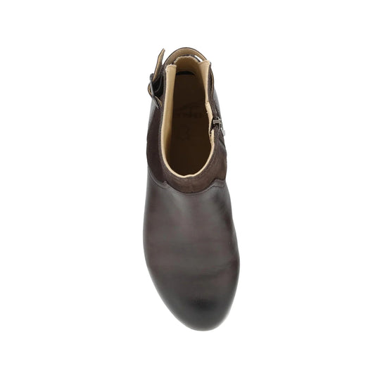 Dark brown ankle boot with a rounded toe and beige lining, shown from above