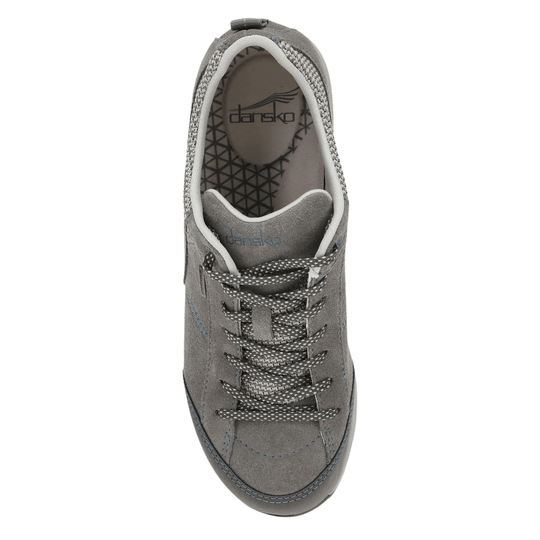 Gray suede sneaker with patterned laces, white collar trim, and visible Dansko branding inside