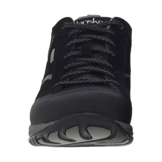 Black lace-up sneaker with a thick treaded sole, shown from the front.