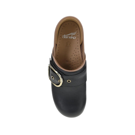 Black leather clog with a tan footbed and side buckle strap, viewed from above