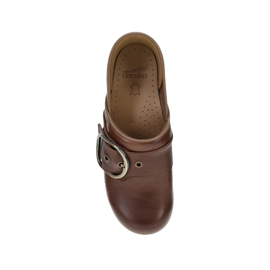 Brown leather clog with a metal buckle strap and perforated insole