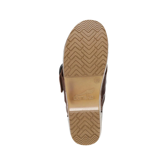 Brown clog shown from the bottom with a tan treaded sole