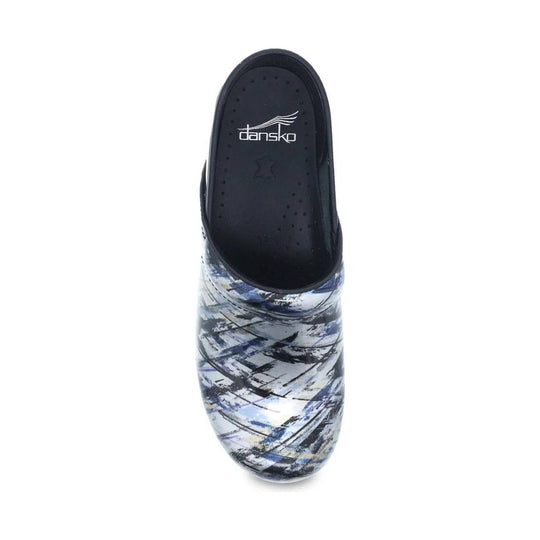 Black clog with blue-and-white abstract print and visible Dansko logo on the footbed
