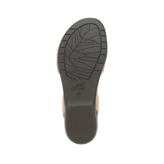 Black outsole of a clog shoe with tread pattern and Dansko logo