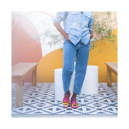 Multicolor strappy sandal worn with light blue jeans