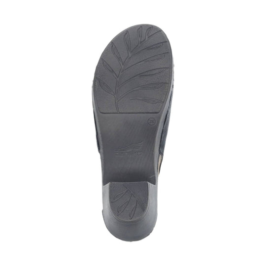 Black shoe outsole with leaf-pattern tread and Dansko logo
