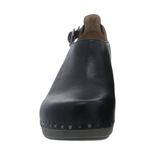 Black clog-style shoe with rounded toe, front view, with side buckle strap