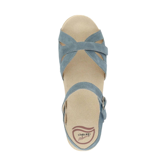 Beige open-toe sandal with crossed blue suede straps and ankle buckle, top view