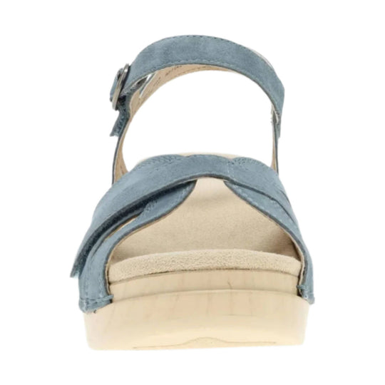 Blue suede sandal with crisscross front straps, ankle strap, and cork platform sole