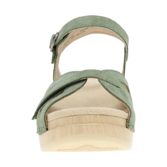 Sage green open-toe sandal with crisscross straps and ankle buckle, front view
