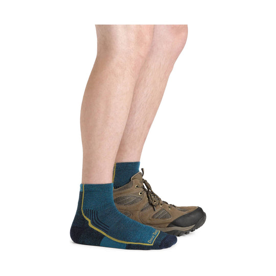Teal and navy quarter hiking sock worn with brown hiking boots