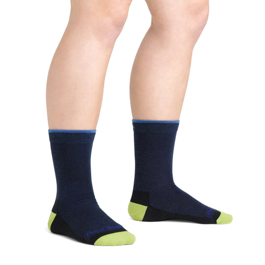 Navy crew hiking socks with lime green toes and heels, shown on a model's lower legs