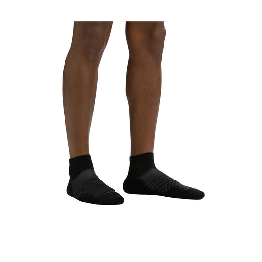 Black ankle running socks on a model's lower legs