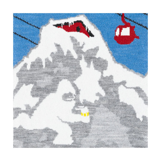 Gray ski sock with a white yeti graphic, blue background, and red cable cars