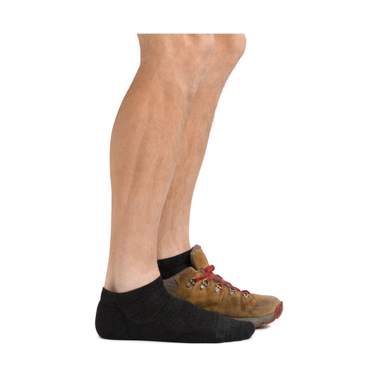 Black no-show sock with a low-cut hiking shoe