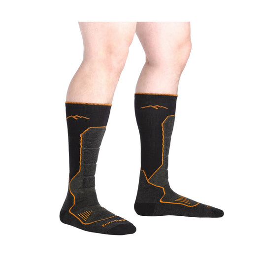 Black over-the-calf socks with orange trim and line accents, shown on legs