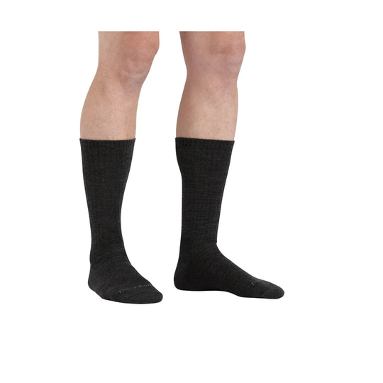 Black knee-high socks on model’s lower legs, shown from the side