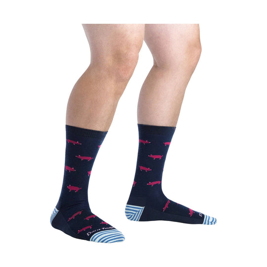 Navy knee-high socks with pink pig pattern and blue striped toes and heels.