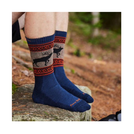 Blue hiking socks with moose-and-reindeer pattern and orange trim