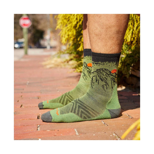 Green patterned crew running socks worn with the toes and heels in dark gray