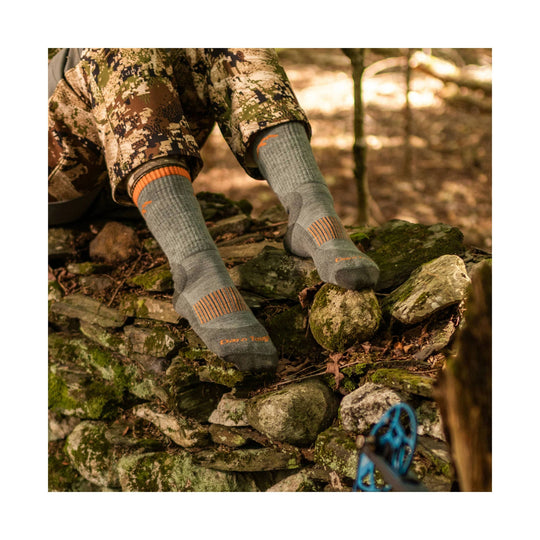 Gray midweight hiking socks with orange striped accents and visible Darn Tough branding