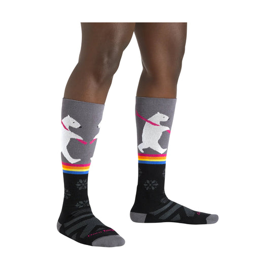 Gray and black knee-high ski socks with white bear and rainbow stripe pattern, shown on legs