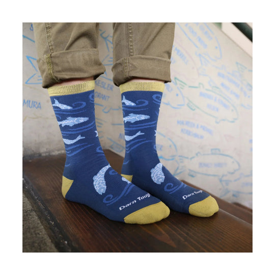 Blue crew socks with yellow cuffs and toes, fish pattern, and visible Darn Tough text