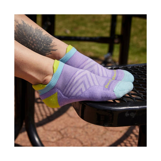 Low-cut lavender sock with light blue and lime trim, shown on a foot
