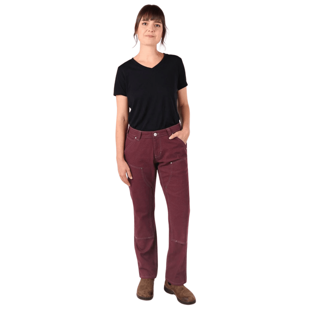 Women’s burgundy work pants with contrast stitching and front patch pockets, worn with a black T-shirt and brown boots