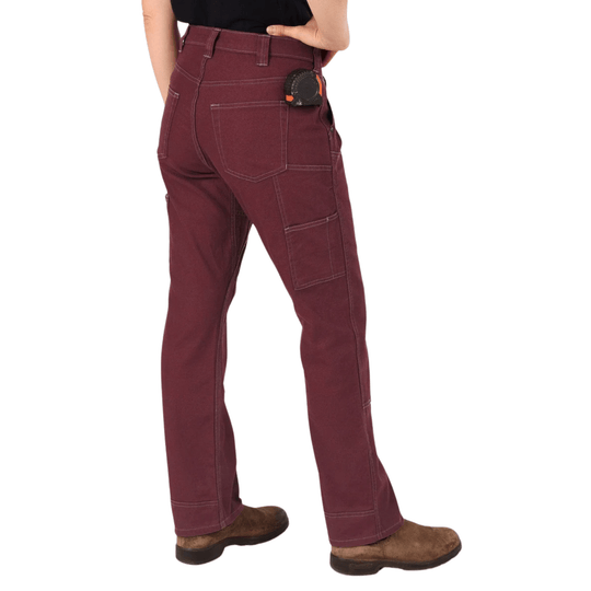 Maroon work pants shown from the back with cargo pockets and brown work boots