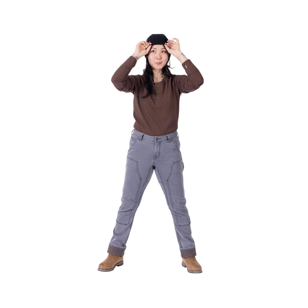 Grey utility pants with front seam panels and rolled cuffs, worn with a brown long-sleeve top and black beanie
