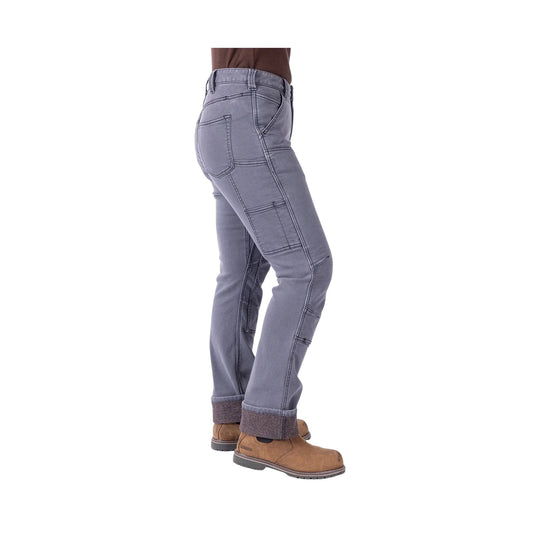 Grey women’s utility pants with cargo pockets and cuffed hems, worn with brown work boots