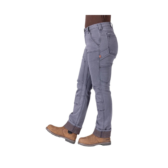 Grey utility pants with reinforced seams, multiple pockets, and cuffed hems, worn with brown work boots