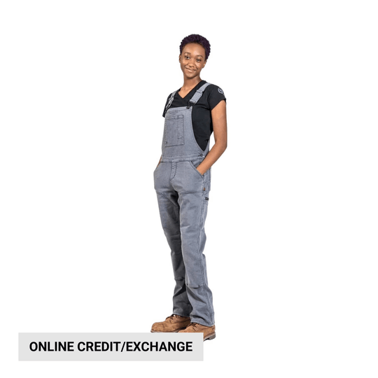 Woman modeling gray denim overalls over a black T-shirt