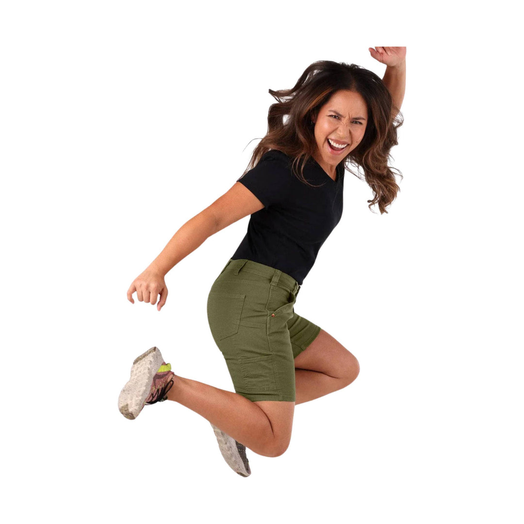 Olive green stretch shorts with front pockets and a mid-rise fit, shown on a jumping model