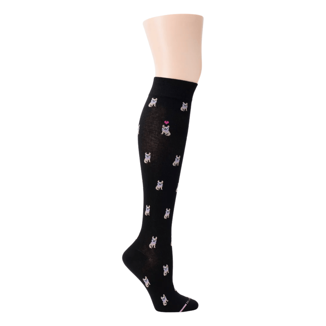 Black knee-high sock with small dog pattern and a pink heart near the top