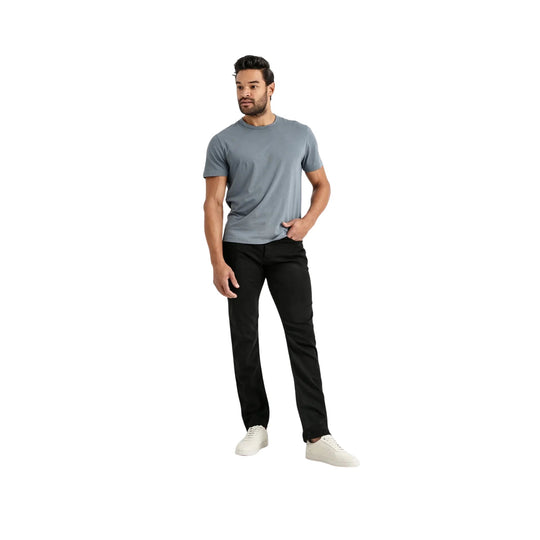 Black relaxed-fit straight-leg pants with a tapered hem, shown on a model with a gray T-shirt and white sneakers.