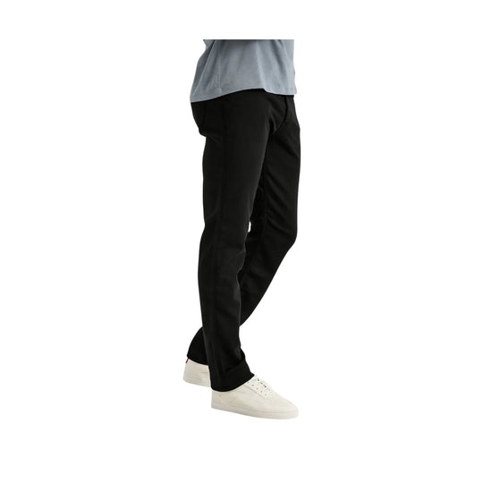 Black relaxed straight-leg pants shown on a model with a gray top and white sneakers.