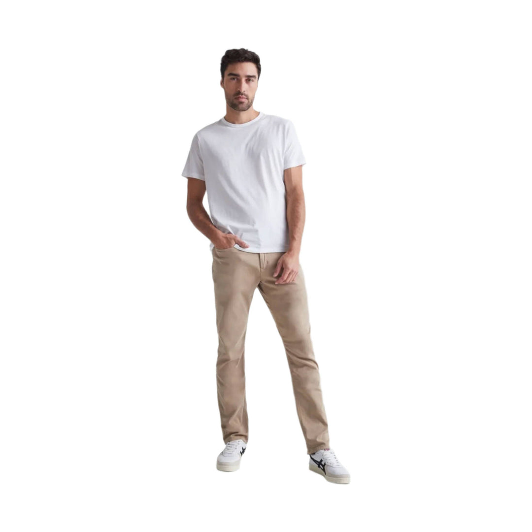Relaxed straight khaki pants worn with a white T-shirt and white sneakers