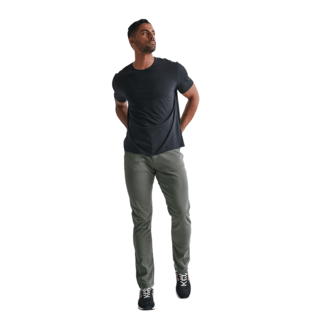 Gray relaxed taper pants on a model, shown full length with a black T-shirt and black sneakers
