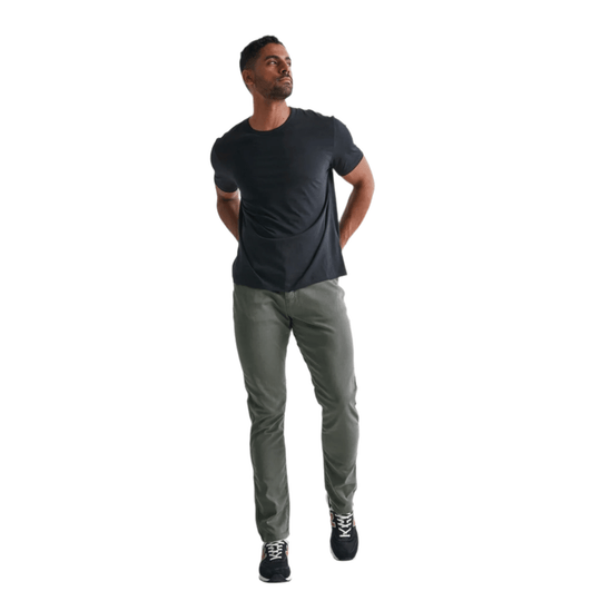 Gray relaxed taper pants on a model, shown full length with a black T-shirt and black sneakers