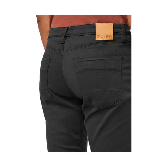 Black relaxed taper pants shown from the back with five pockets and a tan DU/ER waistband patch