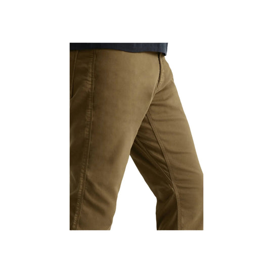 Brown relaxed-fit pants shown from the side on a model