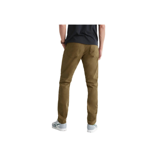 Back view of tan tapered pants with rear pockets, worn with a black T-shirt and gray sneakers