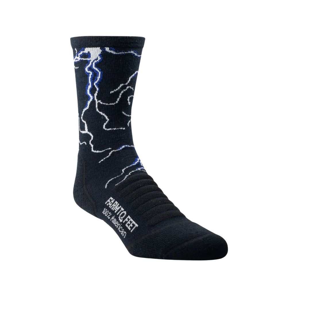 Black crew sock with white and blue lightning-like pattern and visible text on the ankle