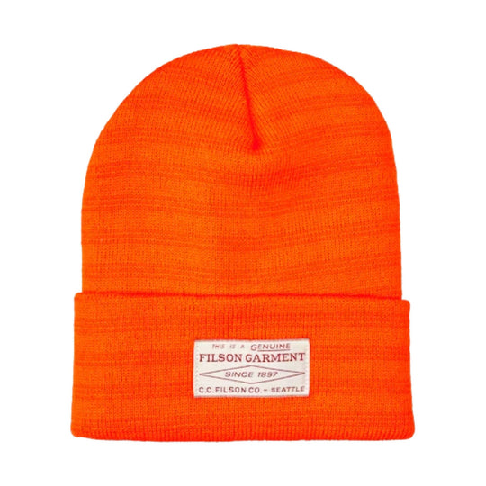 Bright orange knit beanie with a folded cuff and a white front label